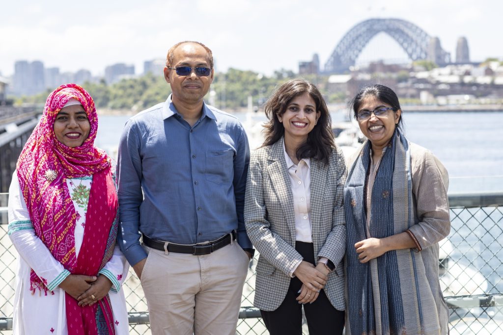 Tahsina (left) photographed with other Australia Awards scholars at the 2024 End of Year event in Sydney.